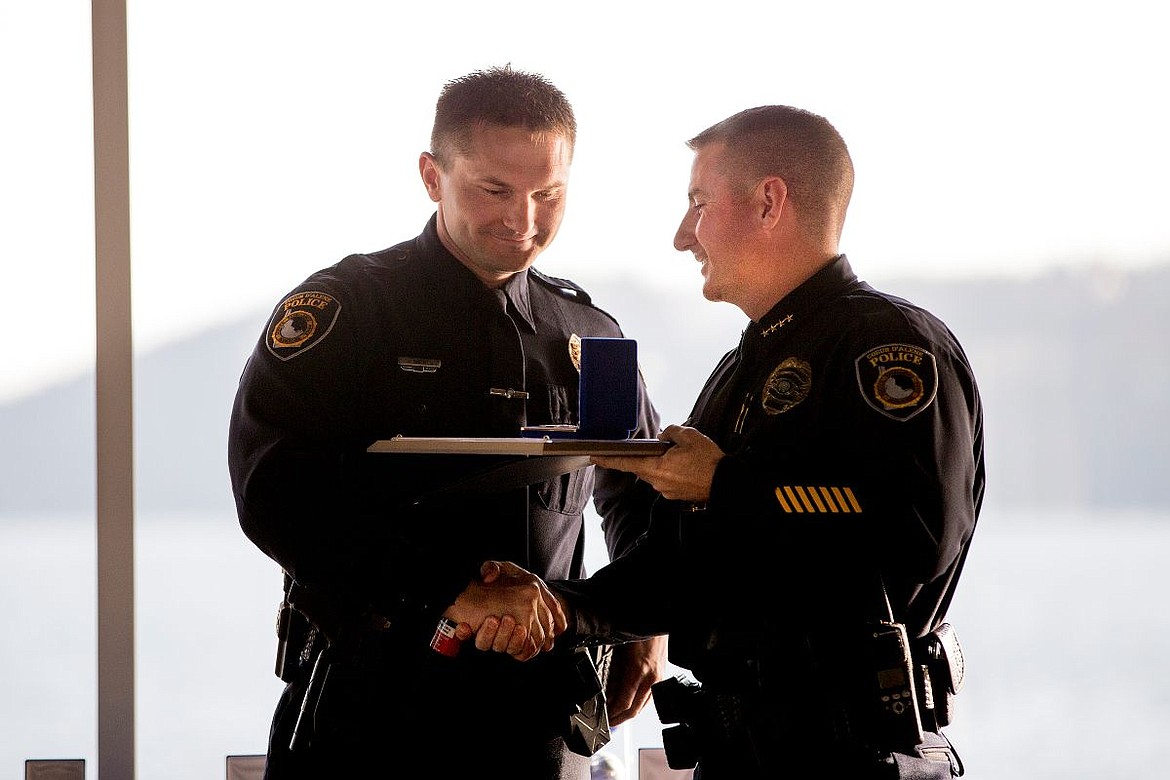 &lt;p&gt;Coeur d'Alene Police Chief Lee White, right, awards police officer Jon Cantrell with the police department's Officer of the Year honor on Monday at the police department's sixth annual awards ceremony at the Hagadone Event Center.&lt;/p&gt;