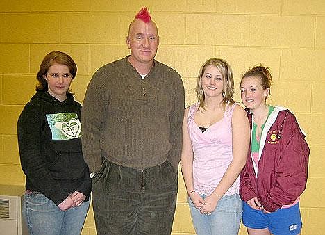 Kelly Palmer shows off his new hairstyle with Troy High School sophomores Brittney Hammrich, Palmer, Katie Hibbs and Teresa Wagner, who led their class in the school's second annual Wings fundraising competition.