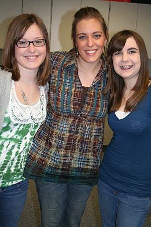 Sarah Kehoe/Columbia Basin Herald<br> Chief Moses Middle School eighth-grader Allison Hammer, left, Gear Up Site Manager Rachel Weaver, center, and Allie White, right, stand together. Hammer and White won an essay contest and a trip to Washington D.C. through the Gear Up program.