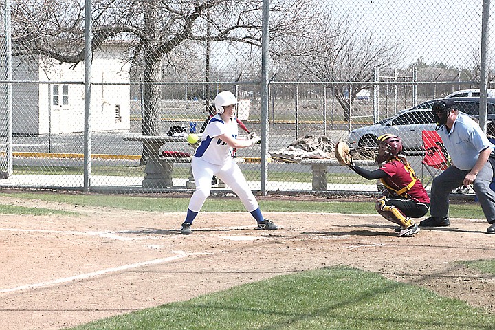 Big Bend's Ali Hirschi, left, takes ball four on Saturday against Yakima Valley CC.