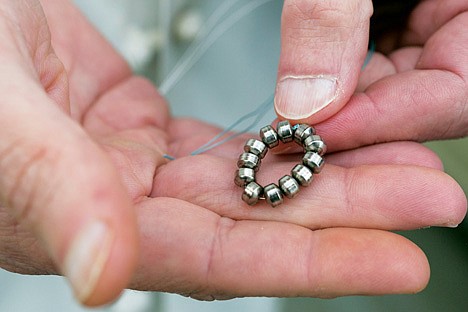 &lt;p&gt;Surgeon Dr. John Lipham holds a sample Linx device at the Hoag Memorial Hospital Presbyterian in Newport Beach, Calif. on Thursday, April 4. The small band of magnetic beads is used to treat chronic heartburn. The bracelet-like device is implanted around a weak muscle at the base of the throat that doesn't close as it should and helps prevent stomach acid from splashing back into the throat.&lt;/p&gt;