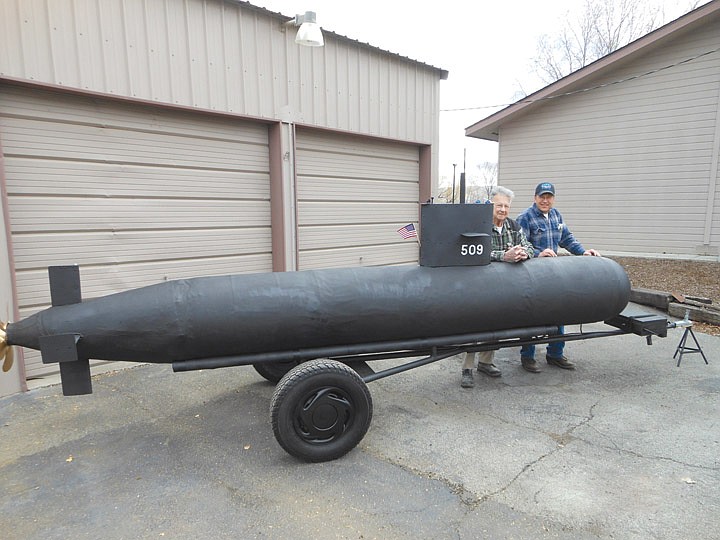 Bill Millard of Desert Aire and Mark Briggs of Yakima, members of the U.S. Submarine Veterans, proudly display the newly constructed USS YAKIMA SSN509 parade float.