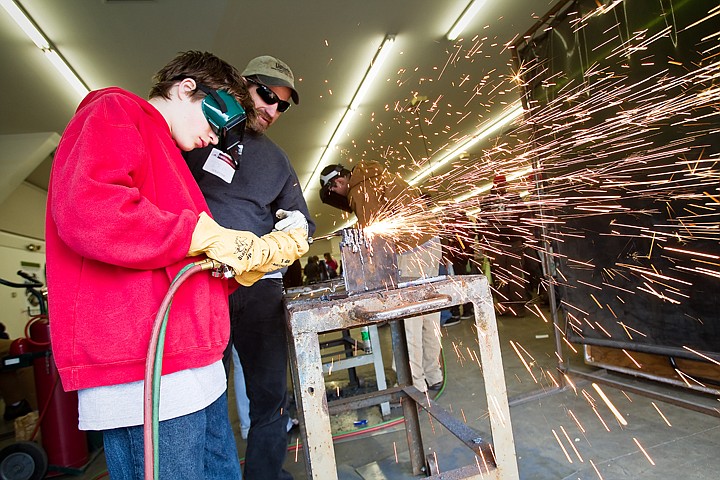 &lt;p&gt;SHAWN GUST/Press Stas Etheridge, a seventh-grader at Genesis Preparatory Acedamy in Post Falls, uses a torch to cut a piece of steel Wednesday as instructed by Ira Floyd, a welding student at North Idaho College, during the 2010 Hard Hat, Hammers and Hot Dogs event at the Kootenai County Fairgrounds in Coeur d'Alene. The Manufacturing and Construction Career Day, in its third year, was hosted by the Workforce Development Task Force, and is aimed at educating local middle and high school students about job opportunities in the industrial sector.&lt;/p&gt;