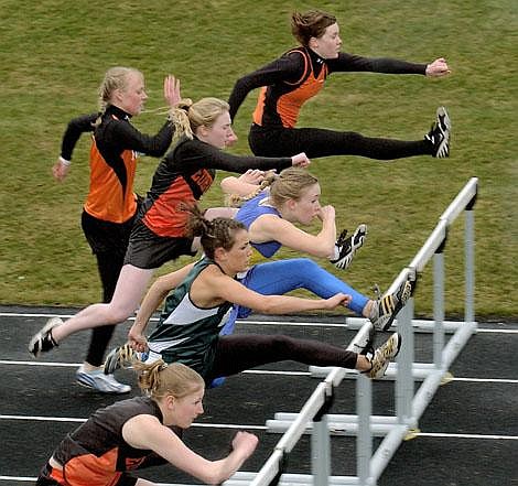 Karen Nichols photos/Daily Inter Lake&lt;br&gt;Girls head for the first set of hurdles in the 100-meter hurdles Tuesday at the Tom Gilman Invitational at Legends Stadium. From lower left are Stephanie Sanders, Eureka, the winner of the race, Emily English of Whitefish, Sarah Becker of Libby, Laura Cameron of Eureka, Tessa Barton of Flathead and Samantha Gunlickson of Flathead.