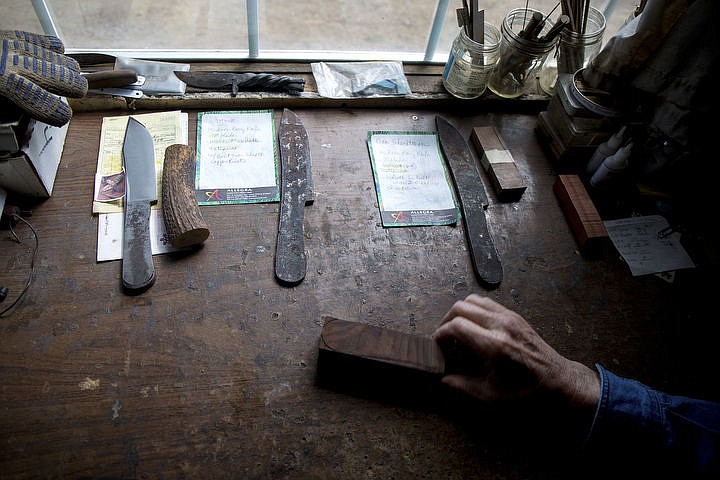 &lt;p&gt;Three blades in various stages of construction, along with customers' specifications for each knife, rest on the workbench of Mike Mann's shop. The blades are made of high-strength, recycled steel leaf springs from automobiles that Mann reshapes and cuts himself.&lt;/p&gt;
