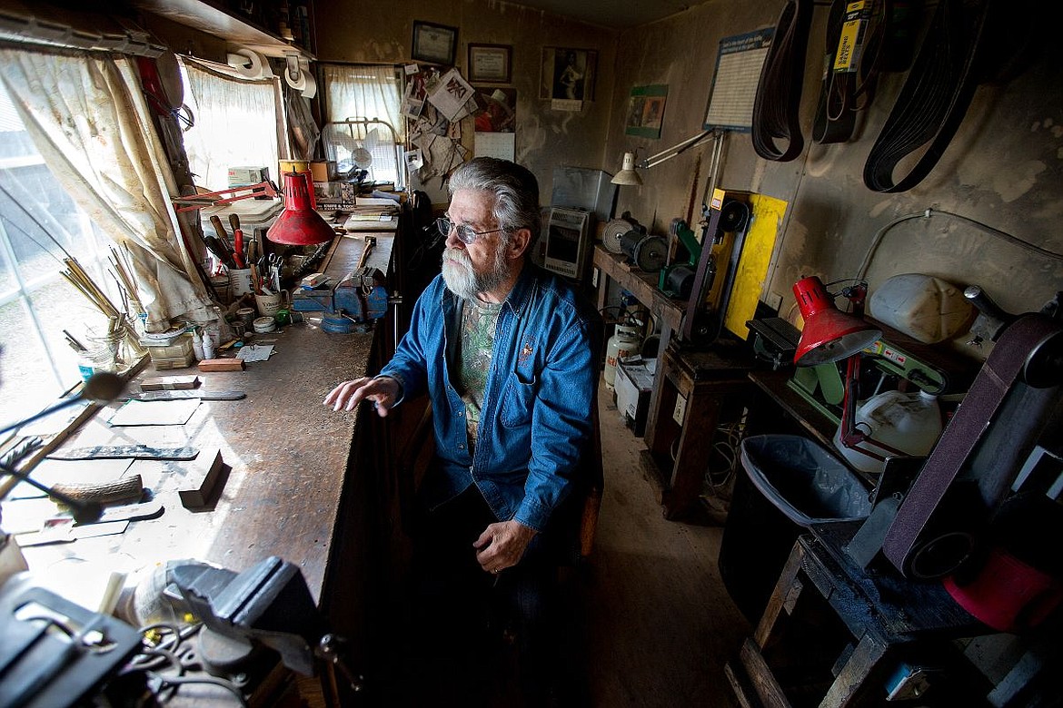 &lt;p&gt;Mike Mann, 71, sits in his knife-making workshop on Monday that is situated on his home property on Hoodoo Mountain.&lt;/p&gt;
