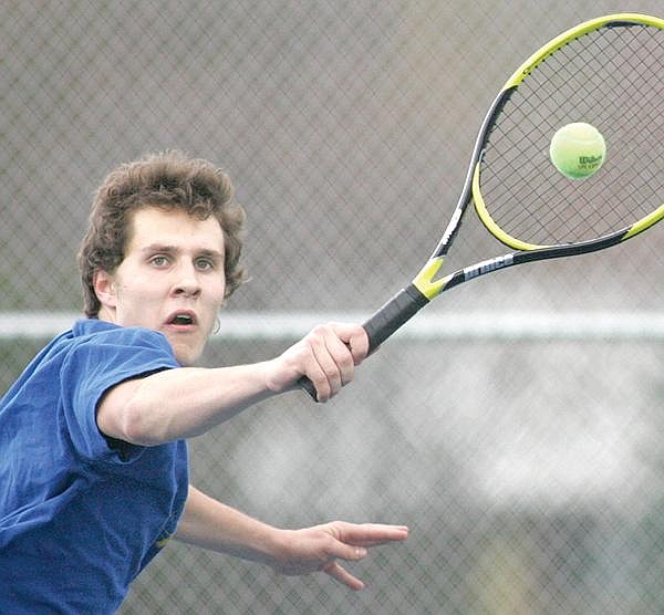 Paul Sievers/The Western News Crawford Dinning of Libby returns a shot against Miroslav Zvgelskiy of Columbia Falls. In a close one, Zvgelskiy took the victory, 7-6 (7-1), 5-7, 6-2.