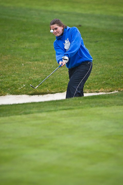 &lt;p&gt;Coeur d'Alene High's Dani Olsen keeps her eye on the ball after hitting her way out of a sand trap on hole six Tuesday during the Coeur d'Alene Invitational at Hayden Lake Country Club and Golf Course.&lt;/p&gt;