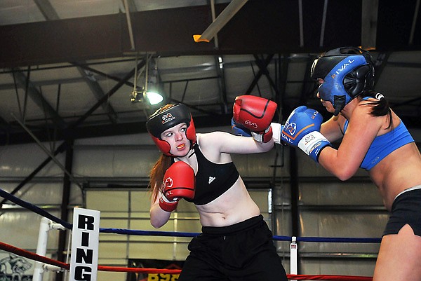 Flathead's Kelsey Davis keeps her arm up to defend against Flathead's Mariah Gladstone.