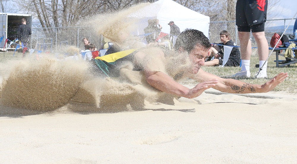 &lt;p&gt;Andrew Managhan lands in the pit during the long jump event.&lt;/p&gt;