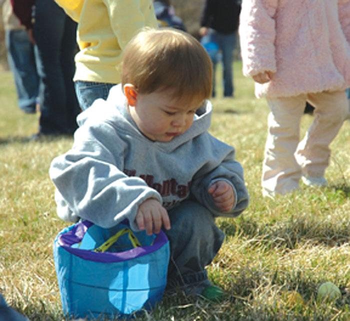 Cody Haggard, 13 months, stumbled upon a slew of easter eggs at the Mission Mountain Enterprises, Inc. sponsored 15th Annual Ronan Community Easter Egg Hunt on Saturday.