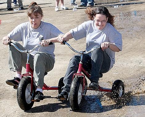 Photo by Aaric Bryan St. Regis&#146; Dana Petty of Schober&#146;s Towing cruises past Susie Sanson at The Talking Bird Saturday.