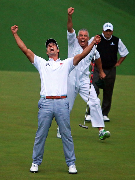 &lt;p&gt;Adam Scott and his caddie Steve Williams reacts to his putt dropping on the second hole of a playoff to win the Masters on Sunday in Augusta, Ga. Runner-up Angel Cabrera watches in the background.&lt;/p&gt;