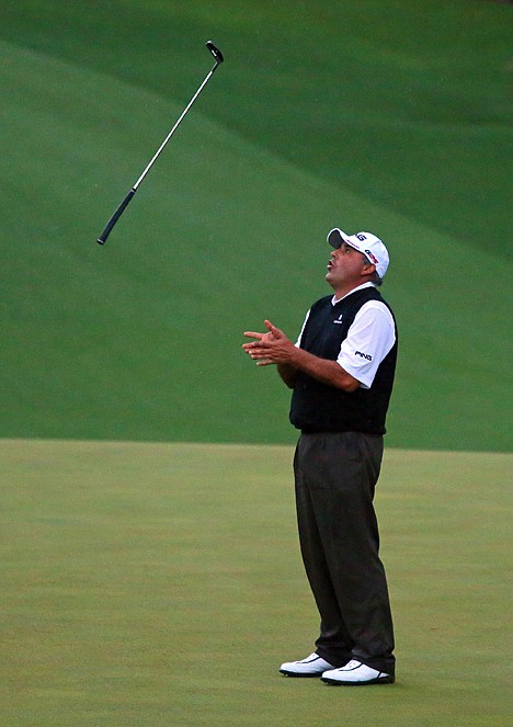 &lt;p&gt;Angel Cabrera tosses his putter in the air after he misses his birdie putt on the second playoff hole on the 10th green. Adam Scott then made his birdie putt to win the Masters for his first major victory.&lt;/p&gt;