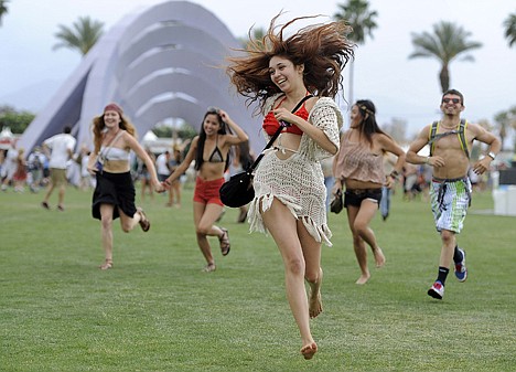 &lt;p&gt;Festivalgoers run toward the main stage to catch the beginning of Kendrick Lamar's set during the first weekend of the 2012 Coachella Valley Music and Arts Festival on Friday in Indio, Calif.&lt;/p&gt;