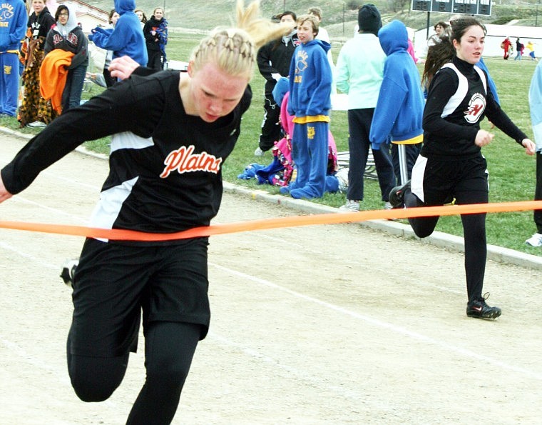 Kayla Holmes crosses the finish line first.