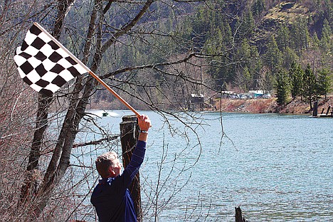 &lt;p&gt;Bob Crump, the mayor of Riggins and official finish line flagger for the World Jet Boat Race, prepares to bring the flag down Saturday as a jet boat approaches the finish line at Idaho Forest Industries Landing in St. Maries.&lt;/p&gt;