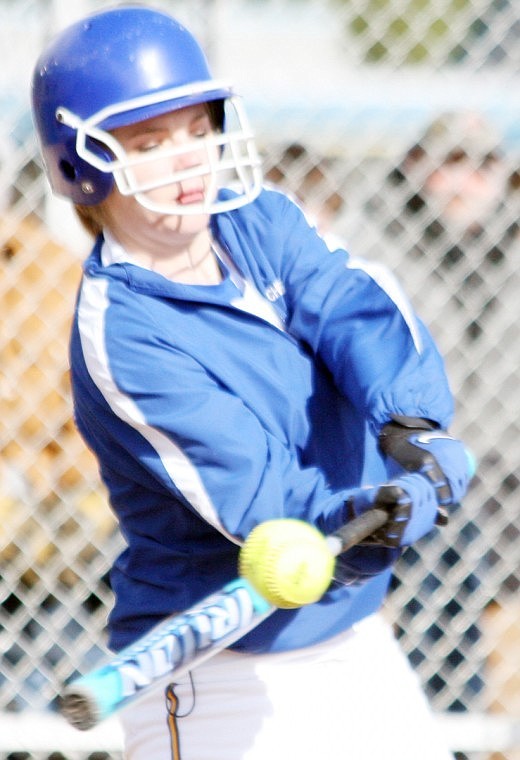 Kelsey Fitchett makes contact against Plains pitcher Aspen Rude.