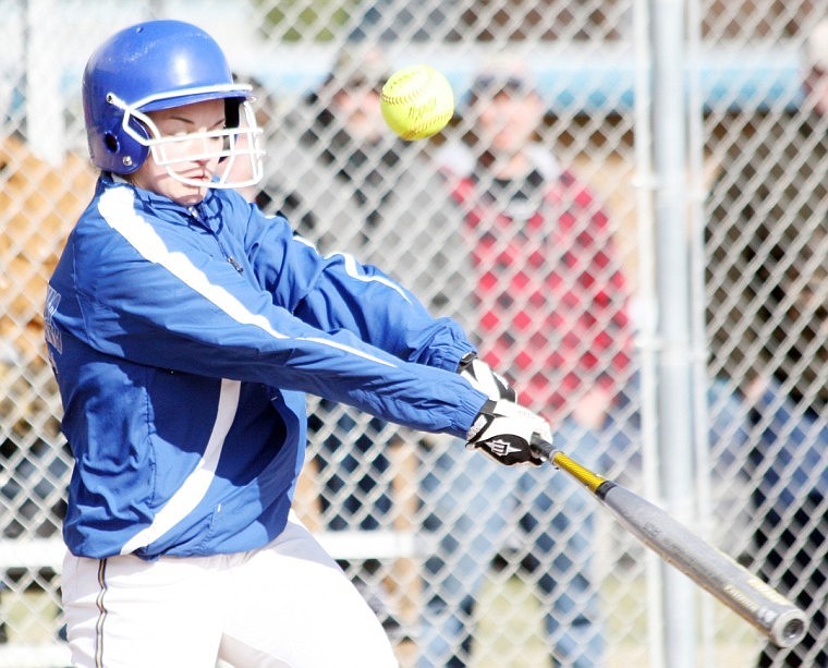 Makayla Becker pops up a foul ball last Thursday during a home game against Plains.