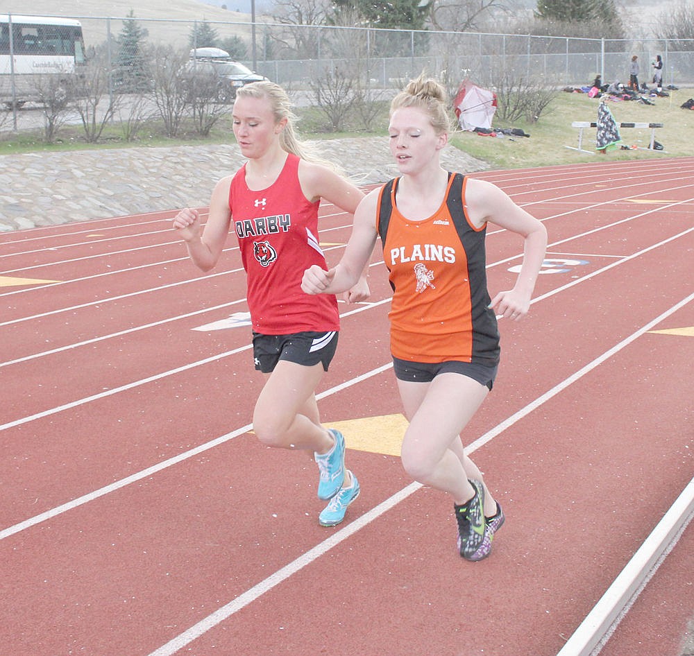 &lt;p&gt;Plains junior Kimberly Earhart (right) competes against an athlete from Darby during the Jim Johnson Invitational earlier in the season.&lt;/p&gt;