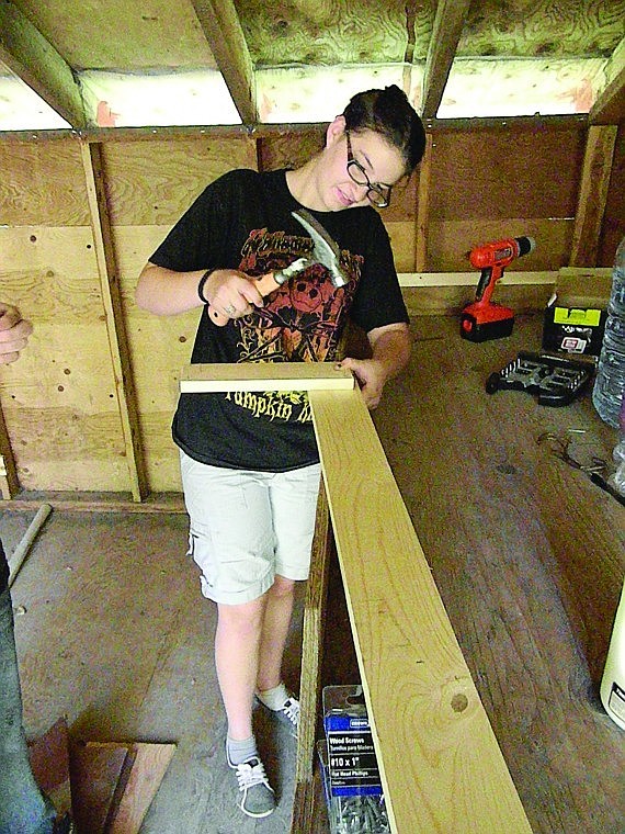 <p>Sagos youngest daughter, Kendra, builds bunkbeds at Camp Westana. Kendra, now a junior at Columbia Falls High School,  along with her 19-year-old sister Deirdra, each put in more than 80 hours making improvements at the camp to earn their Gold Awards, Girl Scouts highest honor.</p>