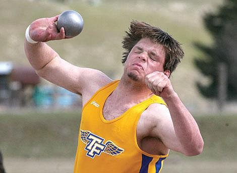 Photo by Ed Moreth Thompson Falls Bluehawk Jason Shaw heaves the shot put 49 feet, 11 inches at the Sanders County Track Meet at Plains Thursday. Shaw nabbed first place at the meet and made a personal best with his throw.