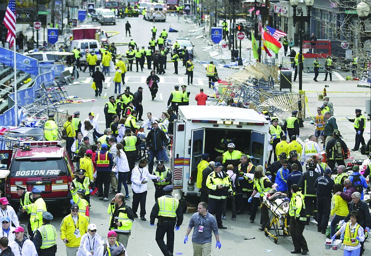 &lt;p&gt;Medical workers help injured people at the finish line.&lt;/p&gt;