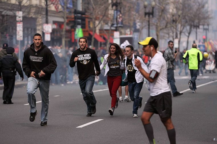 <p><strong>In this photo</strong> provided by The Daily Free Press and Kenshin Okubo, people react to an explosion at the 2013 Boston Marathon on Monday. </p>
