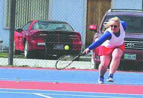 Kaylee Crabb reaches for the tennis ball before it hits the ground during a match last week.