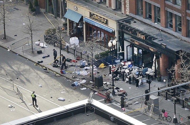 &lt;p&gt;One of the blast sites on Boylston Street near the finish line of the 2013 Boston Marathon is investigated and guarded by police in the wake of two blasts in Boston Monday, April 15, 2013. (AP Photo/Elise Amendola)&lt;/p&gt;