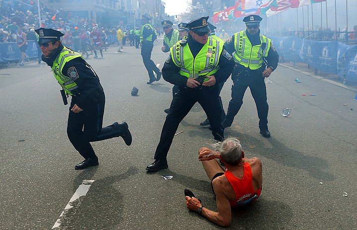 &lt;p&gt;Police officers react to a second explosion at the finish line of the Boston Marathon in Boston, Monday, April 15, 2013. Two explosions shattered the euphoria of the Boston Marathon finish line on Monday, sending authorities out on the course to carry off the injured while the stragglers were rerouted away from the smoking site of the blasts. (AP Photo/The Boston Globe, John Tlumacki)&lt;/p&gt;