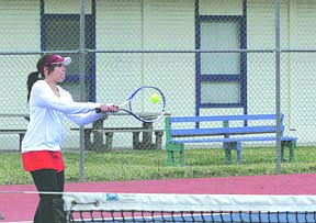 Channel Elliot knocks the ball back to the opponent's side of the net during a match last week.