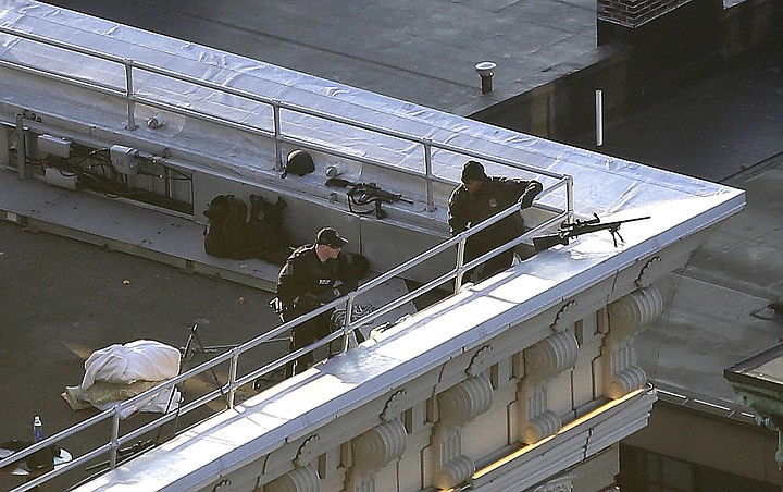 &lt;p&gt;Two police officers have rifles and watch from the roof of the Lenox Hotel overlooking the finish area of the 2013 Boston Marathon in Boston Monday, April 15, 2013. Two bombs exploded earlier in the packed streets near the finish line of the Boston Marathon killing two people and injuring more than 80 others. (AP Photo/Elise Amendola)&lt;/p&gt;