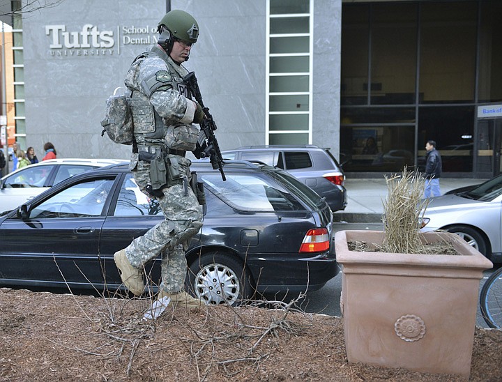 &lt;p&gt;A S.W.A.T officer checks planters on a median in a road next to Tufts Medical Center following an explosion after the Boston Marathon in Boston, Monday, April 15, 2013. (AP Photo/Josh Reynolds)&lt;/p&gt;