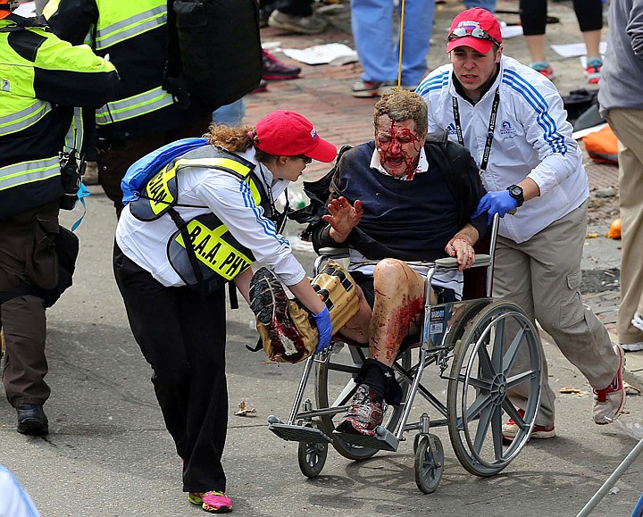 &lt;p&gt;Medical workers aid an injured man at the 2013 Boston Marathon following an explosion in Boston, Monday, April 15, 2013. Two bombs exploded near the finish of the Boston Marathon on Monday, killing at least two people, injuring at least 22 others and sending authorities rushing to aid wounded spectators. (AP Photo/The Boston Globe, David L. Ryan) MANDATORY CREDIT&lt;/p&gt;