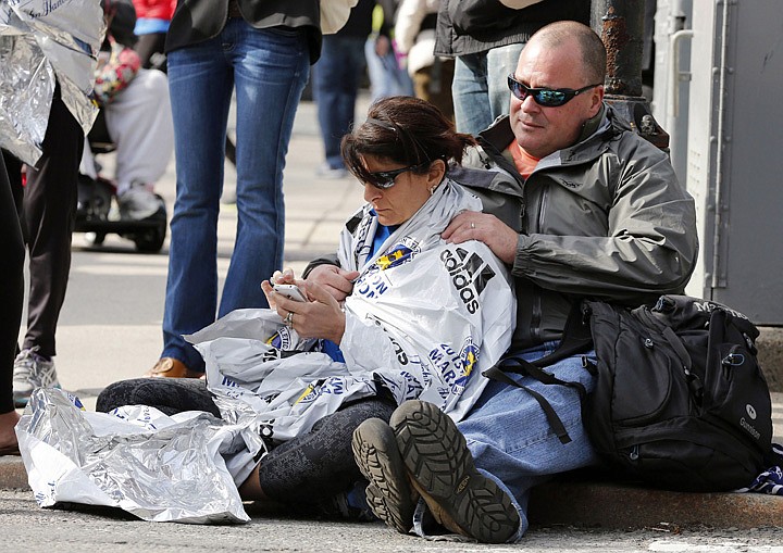 &lt;p&gt;Chris Darmody, right, holds his wife Sue in Boston, Monday, April 15, 2013. Chris says he was waiting for Sue when an explosion detonated near his location at the finish line of the Boston Marathon. The couple were later reunited after all runners were diverted from the course. (AP Photo/Michael Dwyer)&lt;/p&gt;