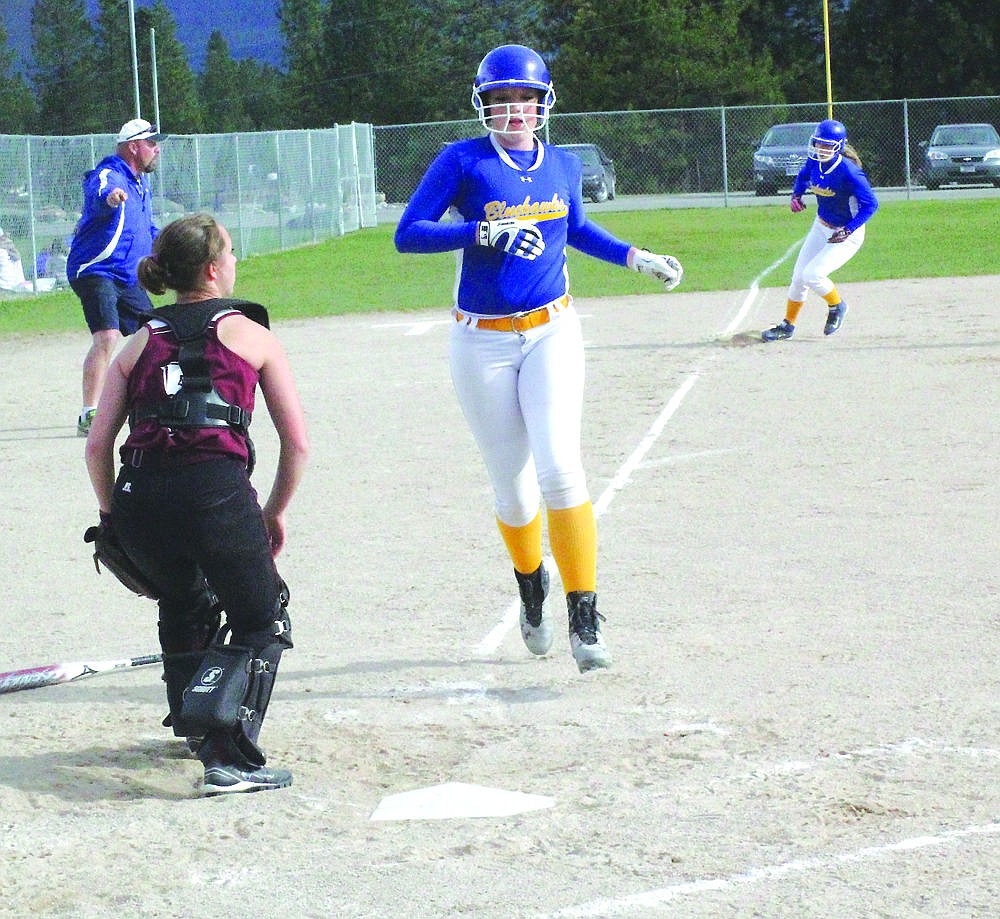 &lt;p&gt;Thompson Falls freshman Lexi Van Elswyk crosses the plate during the Lady Hawks win against Troy last week.&lt;/p&gt;