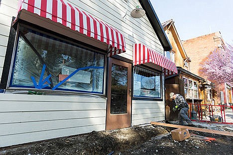 &lt;p&gt;Bill Wright, a carpenter with Basso Construction, works on a drainage system that will divert water from the sidewalk, to be poured in the next couple of days, during renovation work on the Harrison Creamery and Fudge Factory last Wednesday in Harrison.&lt;/p&gt;