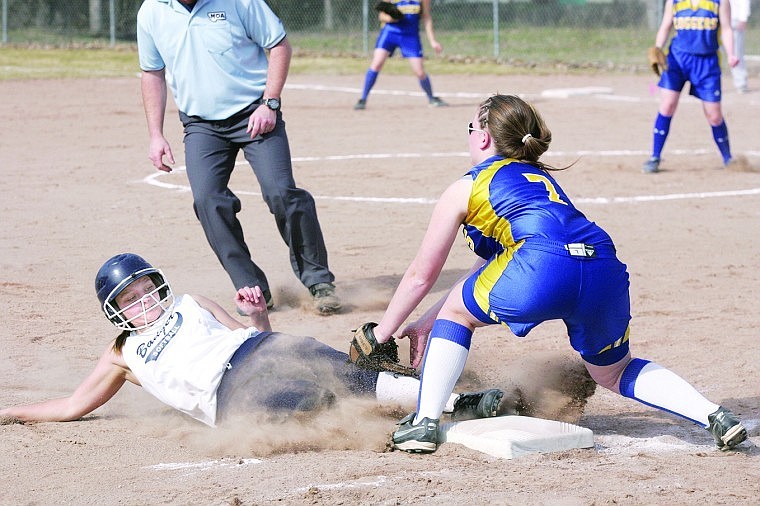 &lt;p&gt;Abby Skeen slides safely under the tag of third baseman Auria Benefield top of 4th inning, first of a doubleheader.&lt;/p&gt;