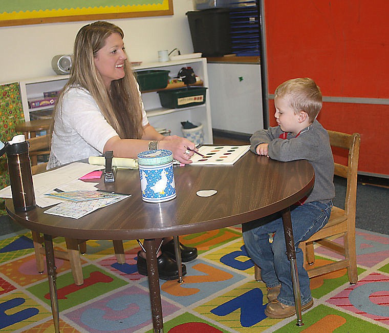 &lt;p&gt;Kindergarten teacher Dana Diehl works with Chad McGonagle, 4, on his developmental screening where they went over colors, numbers, shapes, among other things.&lt;/p&gt;