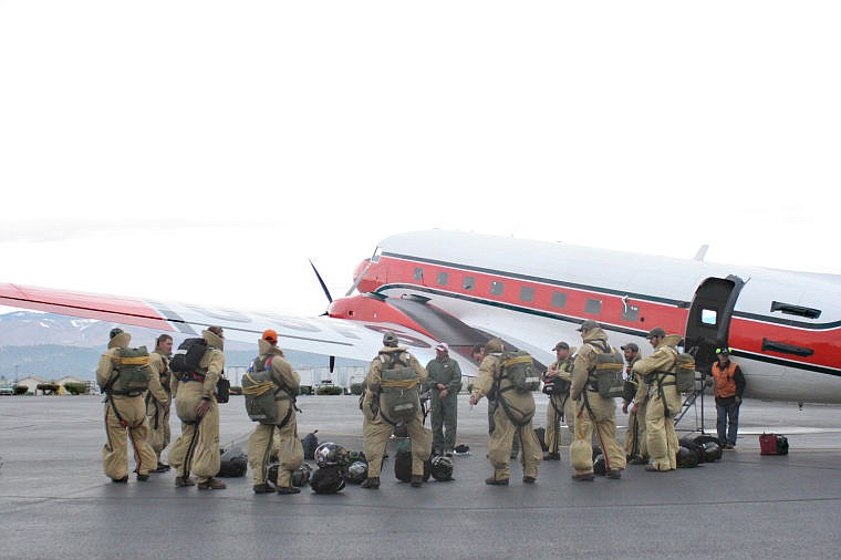 &lt;p&gt;Smokejumpers with the U.S. Forest Service go through a pre-flight briefing before boarding a DC-3 in Missoula for a practice jump.&lt;/p&gt;