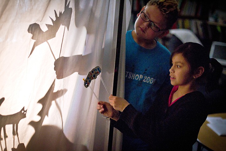 &lt;p&gt;JEROME A. POLLOS/Press Devin Ekness, 10, and his classmate Mia Maldonado, 9, play with their shadow puppets during class Friday at Ponderosa Elementary in Post Falls.&lt;/p&gt;