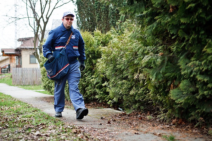 &lt;p&gt;John Kinyon, a letter carrier for the United States Postal Service, delivers mail Friday during his shift in Coeur d'Alene. Kinyon, the sole provider for his family, relocated here from California more than a year ago and is happy with lower cost-of-living expenses.&lt;/p&gt;