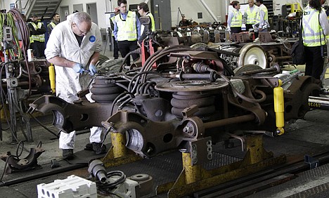 &lt;p&gt;In this photo taken April 11, Bay Area Rapid Transit (BART) mechanic Doug Isonio works on parts for a BART train during a tour of the BART Maintenance Yard in Hayward, Calif. Driven by high gas prices and an uncertain economy, Americans are turning to trains and buses to get around in greater numbers than ever before. The aging trains and buses they're riding, however, face an $80 billion maintenance backlog that jeopardizes service just when it's most in demand.&lt;/p&gt;