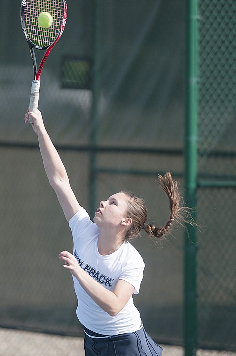 <p>Glacier's Katya Kulikova serves the ball during a singles match against Bigfork's Shelby Scoggins at Flathead Valley Community College Monday afternoon. </p>