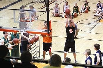 Flathead High School junior Karl Ingram shoots free throws during the 8th Annual Les Schwab Shootout at Flathead on Wednesday. Players from six Valley schools were given one minute each to make as many free throws as possible. Nate Chute photo/Daily Inter Lake