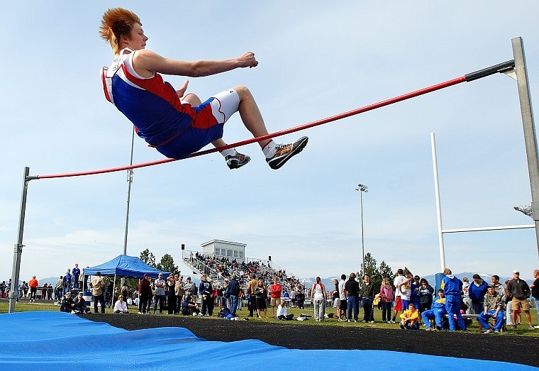 Bigfork&#146;s Ben Sandry attempts to clear the bar in the high jump during the Bigfork Invitational Saturday morning. Sandry finished fourth with a jump of 5-foot-8.