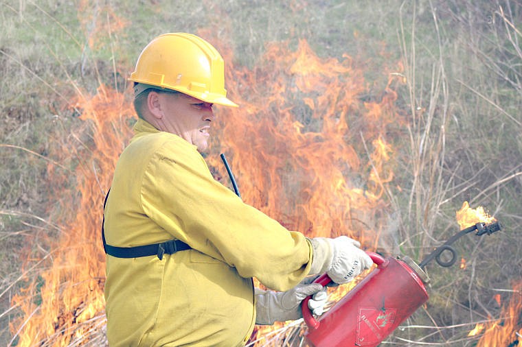 &lt;p&gt;J.C. McGee uses a drip torch to set a prescribed burn off Upper Lynch Creek Road.&lt;/p&gt;