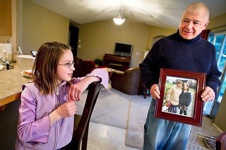 &lt;p&gt;Rory Stowell, of Rathdrum, talks with his daughter Katya, 10, about what she remembers from Russia Tuesday while showing a picture from the children's home where she lived before being adopted by the Stowells.&lt;/p&gt;