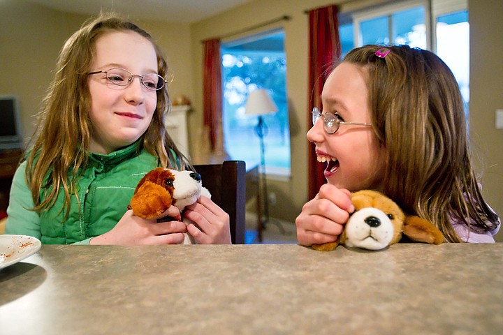 &lt;p&gt;Erika Stowell, 11, left, and her Russian sister Katya, 10, giggle together Tuesday while playing with stuffed animals at their Rathdrum home.&lt;/p&gt;